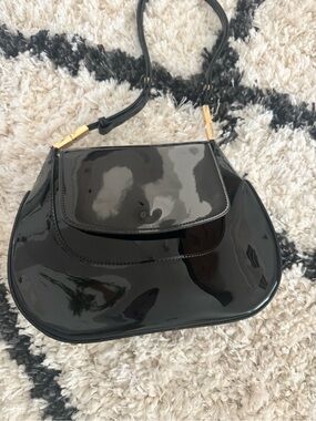 Sleek Black Patent Shoulder Bag with Gold Accents